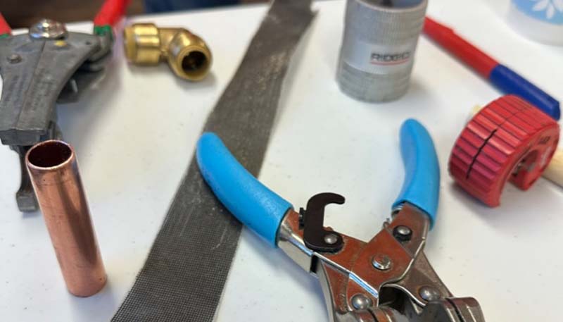 drain cleaning tools on table